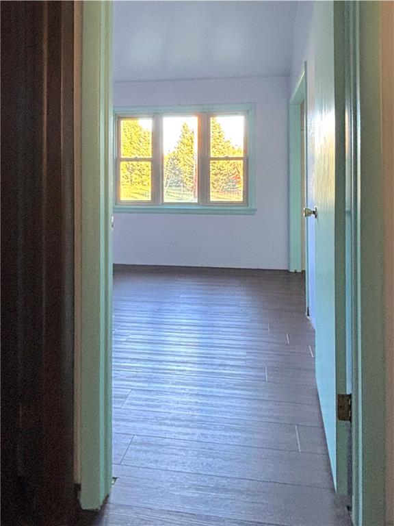 1568 Pulaski Mercer Road Mercer, PA 16137 - Photo 13 of 18 a view of an empty room with wooden floor and a window