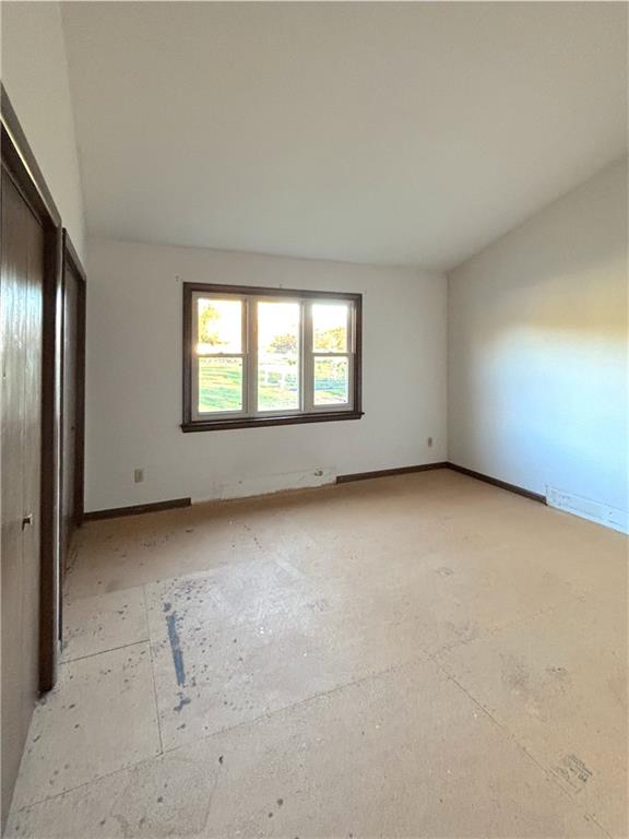 1568 Pulaski Mercer Road Mercer, PA 16137 - Photo 15 of 18 an empty room with a empty space and windows