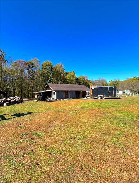 1568 Pulaski Mercer Road Mercer, PA 16137 - Photo 4 of 18 a front view of a house with a yard