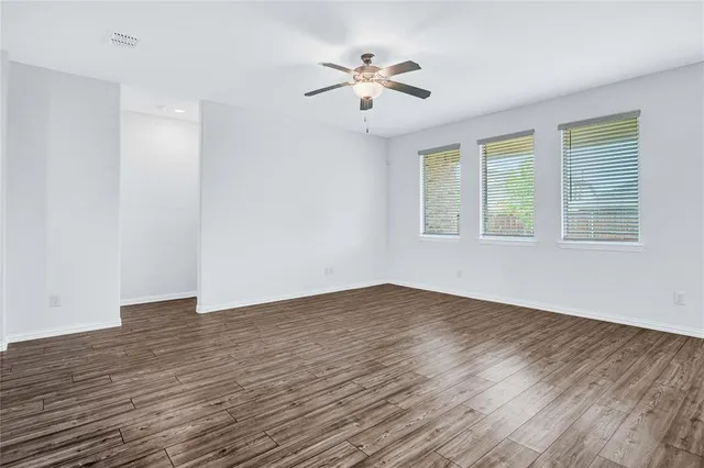 a view of kitchen with cabinets and wooden floor