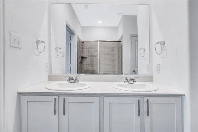 an empty room with closet and a ceiling fan