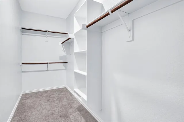 a bathroom with a sink double vanity and a mirror