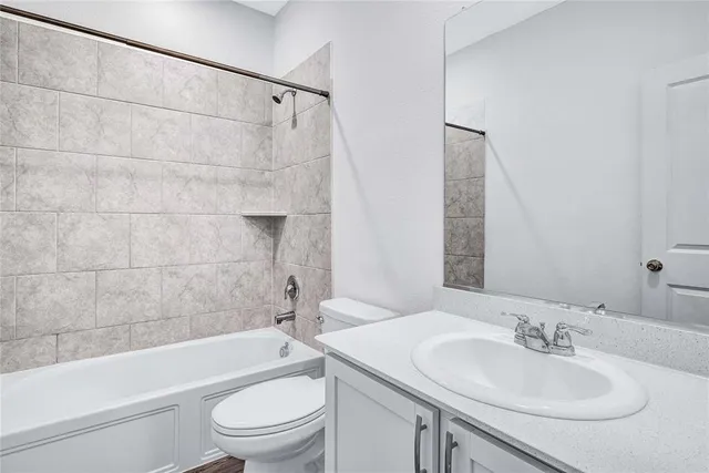 a bathroom with a sink a toilet and a bathtub