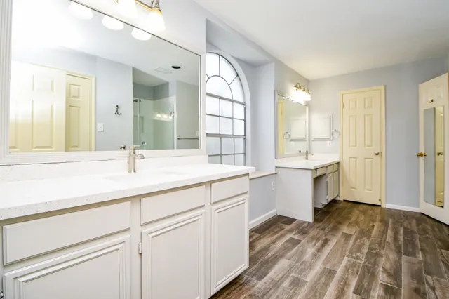 a view of a room with wooden floor