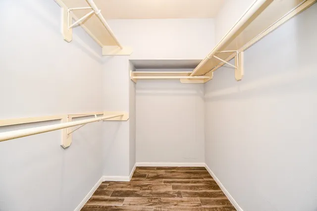a living room with furniture and a book shelf