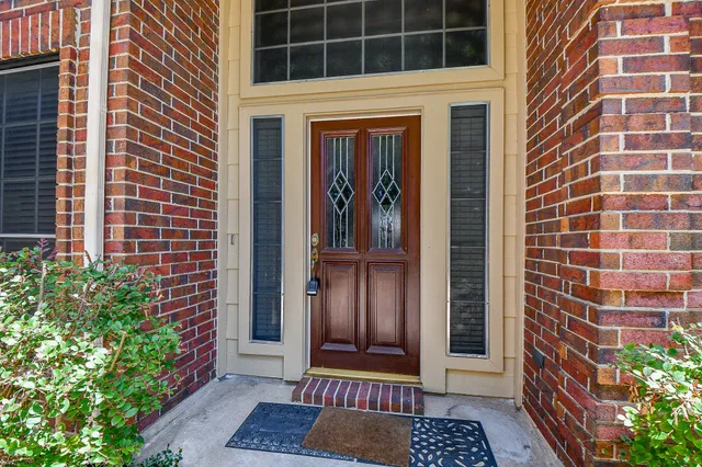 a view of a door and a window