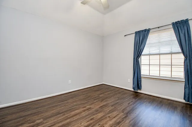 a bedroom with bed and window