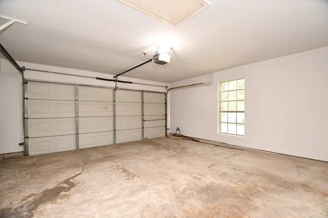 a view of a backyard with wooden fence