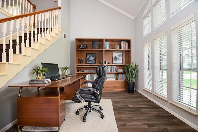 a workspace with furniture hardwood and a window