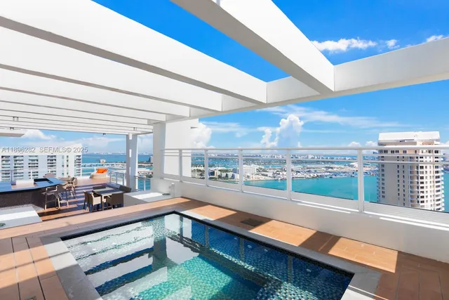 a kitchen with stainless steel appliances granite countertop a lot of counter space and a window