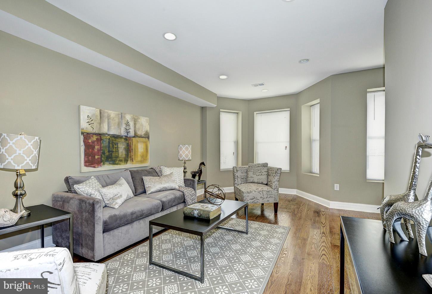1925 North Capitol Street Northeast, Unit 2 Washington, DC 20002 - Photo 2 of 22 a living room with furniture and a large window