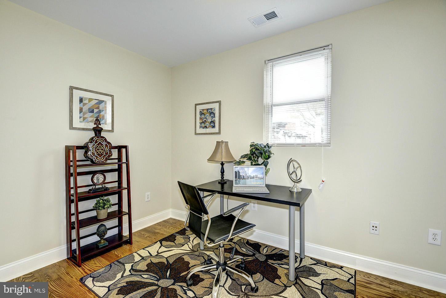 1925 North Capitol Street Northeast, Unit 2 Washington, DC 20002 - Photo 16 of 22 a view of a workspace with furniture and a window