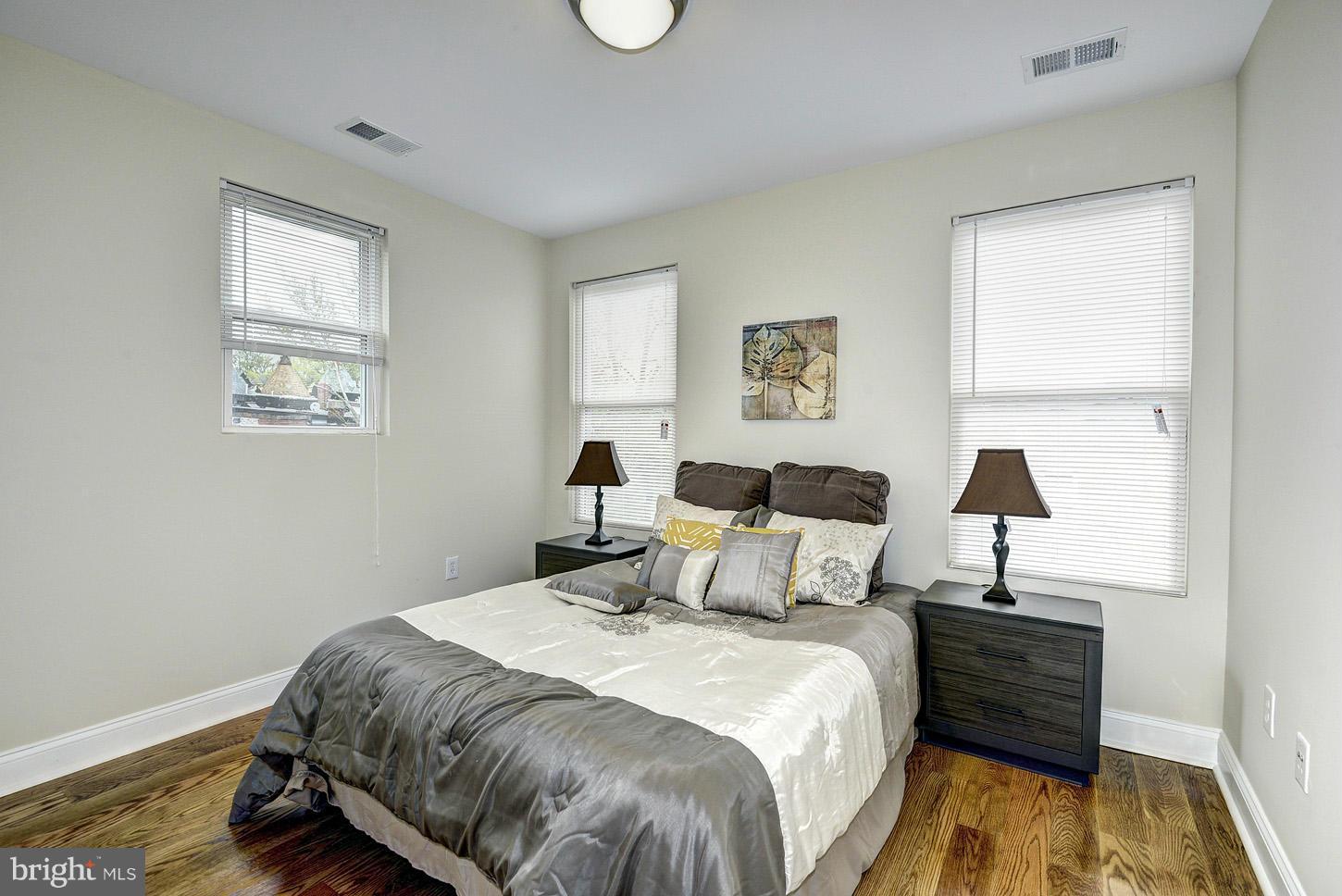 1925 North Capitol Street Northeast, Unit 2 Washington, DC 20002 - Photo 17 of 22 a bedroom with a bed and a window