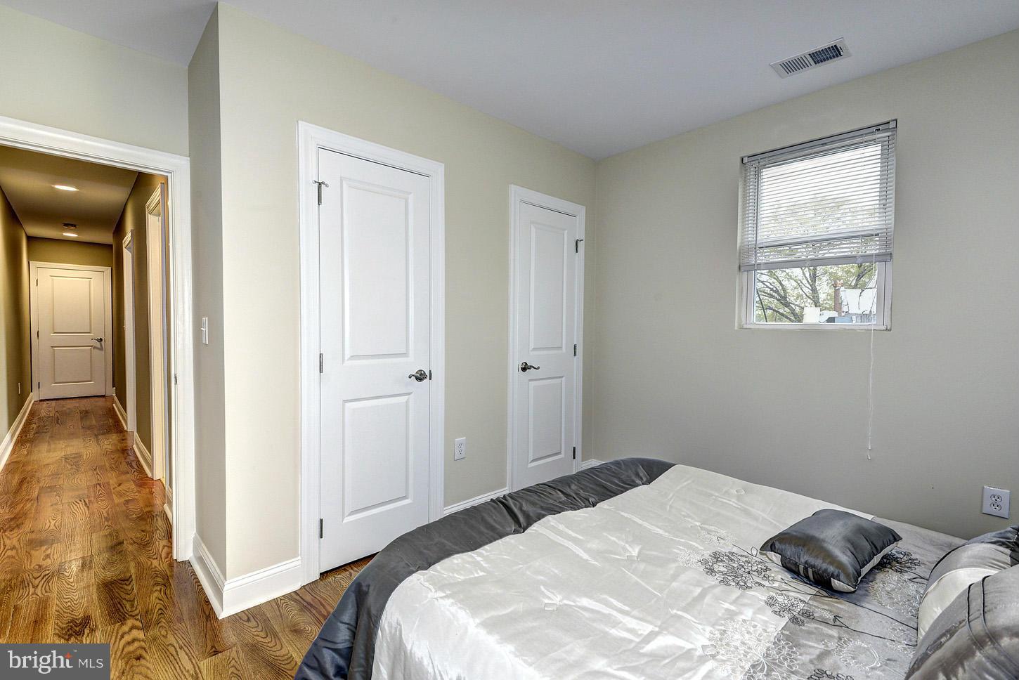 1925 North Capitol Street Northeast, Unit 2 Washington, DC 20002 - Photo 18 of 22 a bedroom with a bed and a window