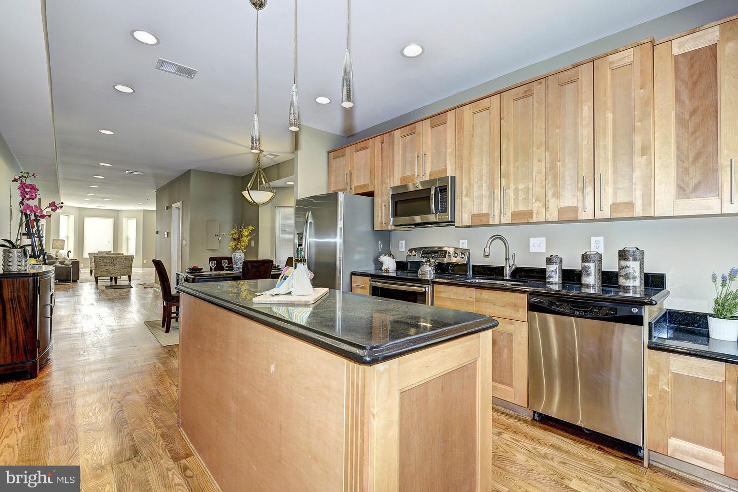 1925 North Capitol Street Northeast, Unit 2 Washington, DC 20002 - Photo 7 of 22 a kitchen with stainless steel appliances granite countertop a sink a stove and a refrigerator