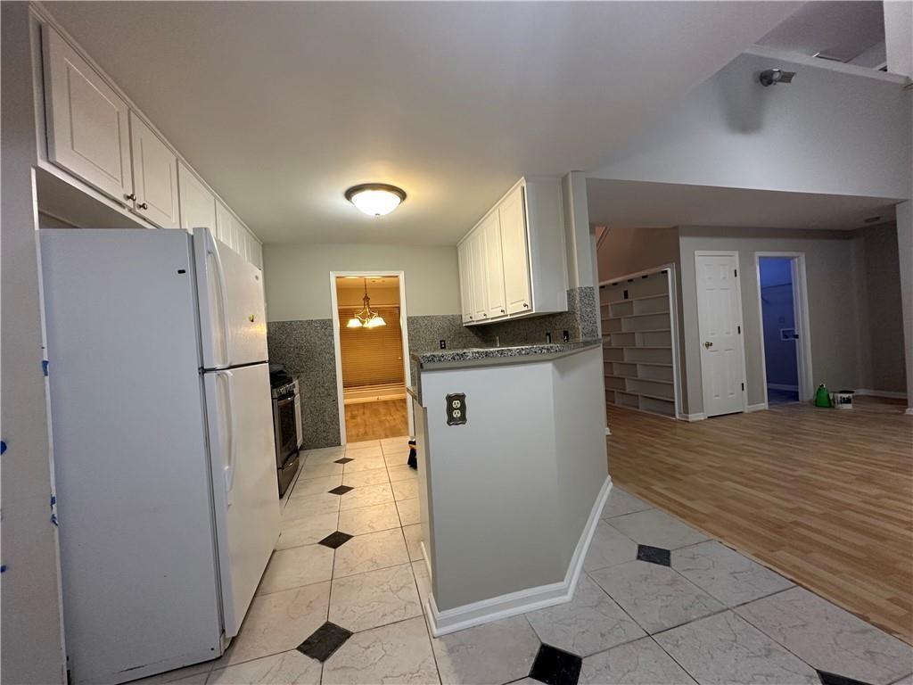 6770 Biscayne Rex, GA 30273 - Photo 11 of 24 a kitchen with stainless steel appliances a refrigerator and a sink