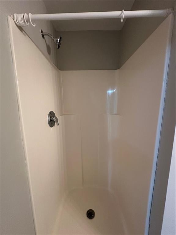 6770 Biscayne Rex, GA 30273 - Photo 19 of 24 a bathroom with a glass shower door
