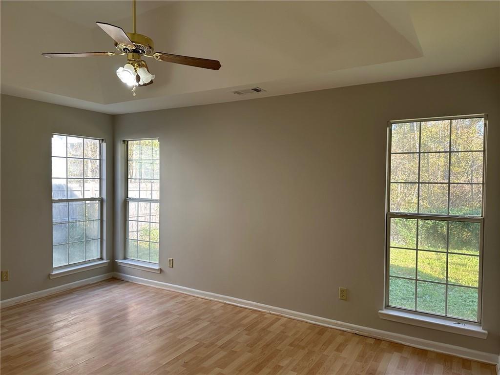 6770 Biscayne Rex, GA 30273 - Photo 21 of 24 an empty room with windows and ceiling fan