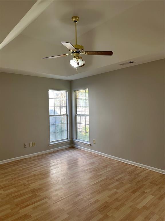 6770 Biscayne Rex, GA 30273 - Photo 22 of 24 an empty room with wooden floor fan and windows