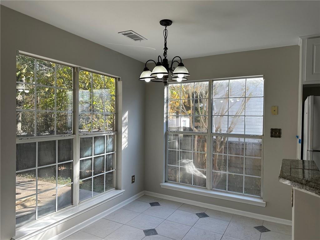 6770 Biscayne Rex, GA 30273 - Photo 3 of 24 a bathroom with a glass shower and a window