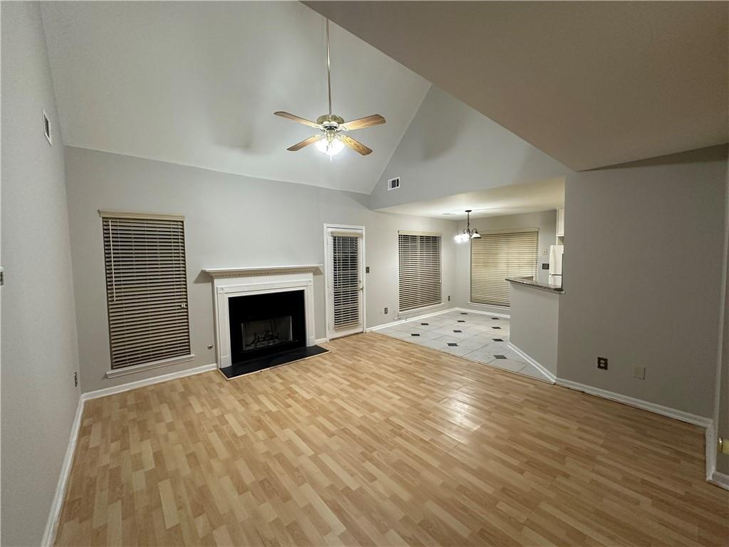 6770 Biscayne Rex, GA 30273 - Photo 4 of 24 a view of an empty room with a fireplace and a ceiling fan