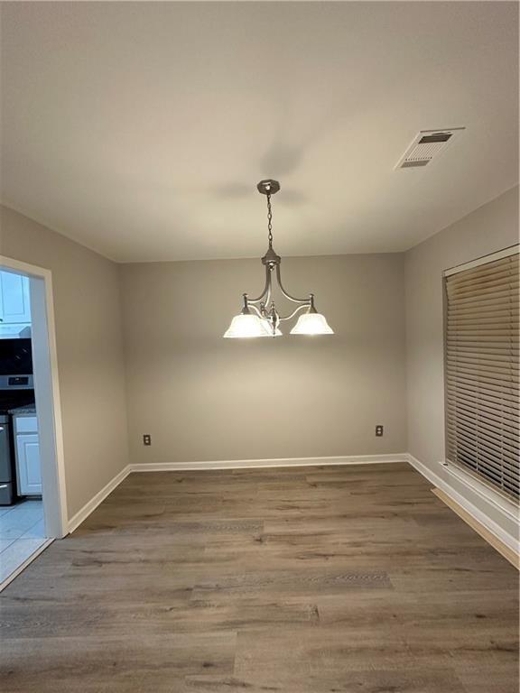 6770 Biscayne Rex, GA 30273 - Photo 7 of 24 a view of a room with wooden floor and window