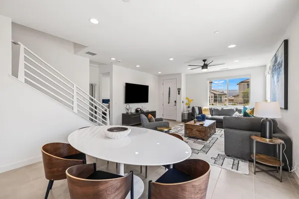 a large kitchen with a table and chairs