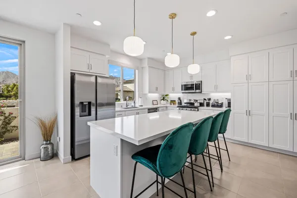 a view of a livingroom with furniture and stairs
