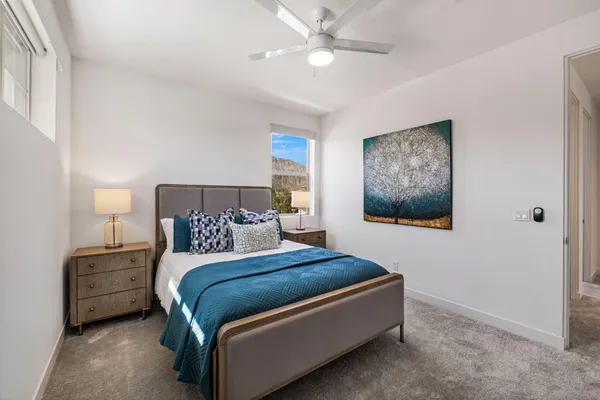 a kitchen with a granite countertop sink a stove and a refrigerator