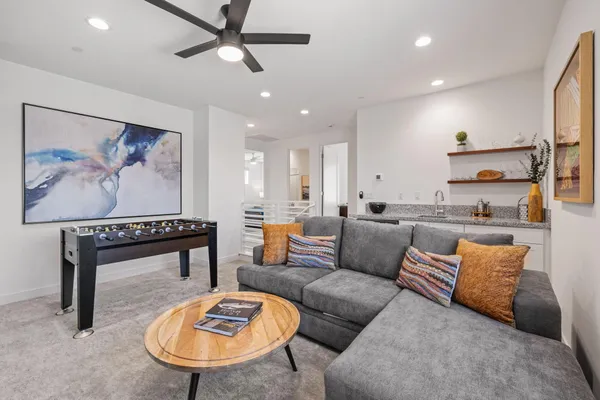 a view of a patio with table and chairs with wooden floor