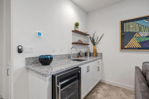 a backyard of a house with table and chairs