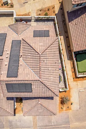 a view of a patio with table and chairs with wooden floor and fence