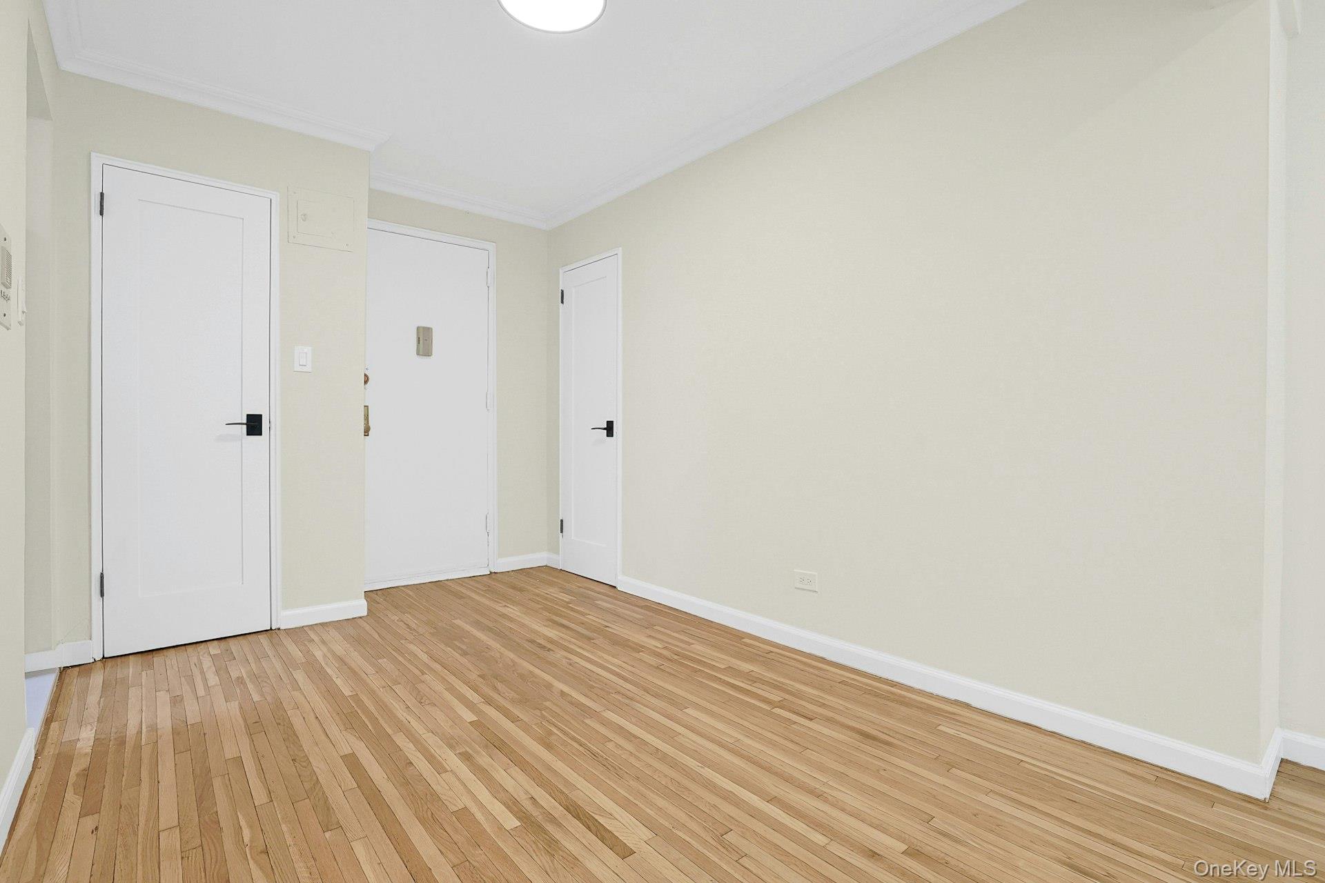 3363 Sedgwick Avenue, Unit 4D Bronx, NY 10463 - Photo 12 of 23 a view of an empty room with wooden floor