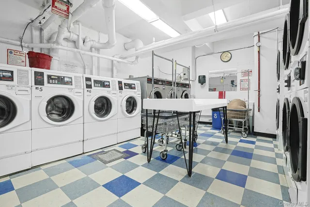 a view of a storage & utility room with washer and dryer