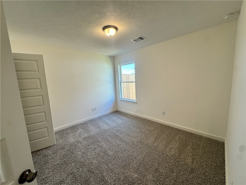 2425 Rooke Road Bryan, TX 77807 - Photo 5 of 10 an empty room with a window