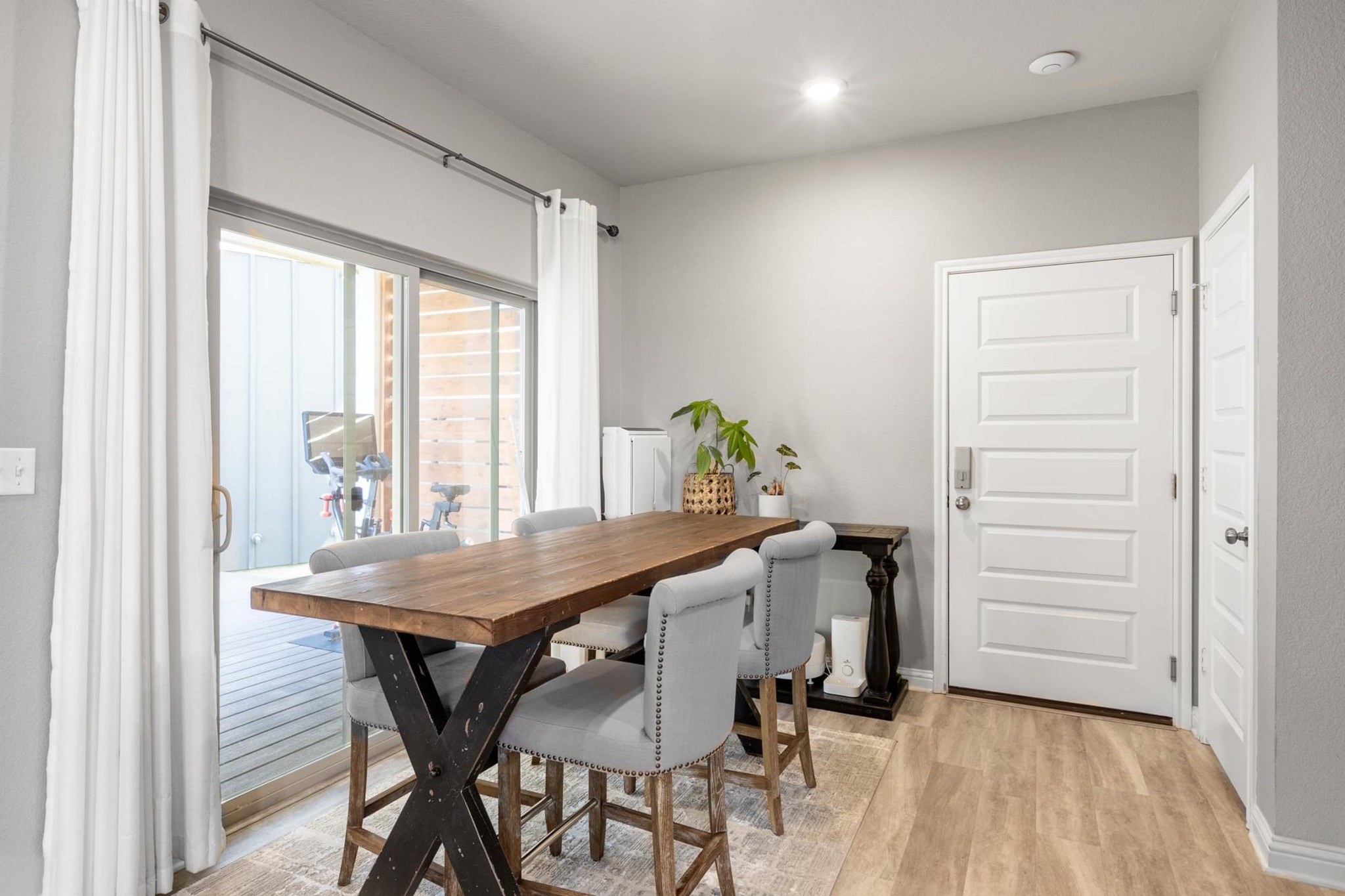7801 Frida Bend Austin, TX 78744 - Photo 6 of 26 A light-filled dining space offers direct access to an outdoor patio through sliding glass doors.