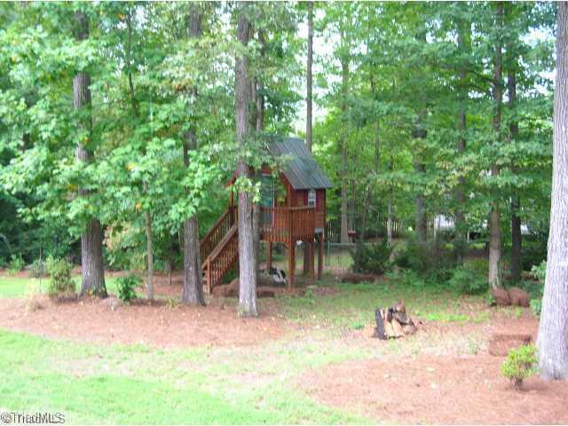 4006 Rockingham Road South Greensboro, NC 27407 - Photo 12 of 16 Other. Back yard- is wooded, fenced across the back, and even has a playhouse!! Full of hardwoods and really pretty year round!!