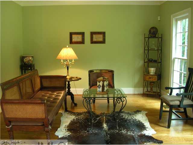 4006 Rockingham Road South Greensboro, NC 27407 - Photo 3 of 16 Living Room. The Living Room- is very open from the foyer has nice long windows and hardwood floors