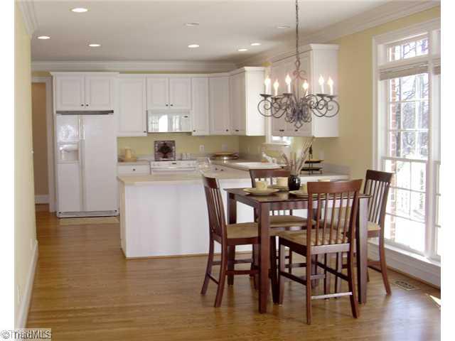 4006 Rockingham Road South Greensboro, NC 27407 - Photo 5 of 16 Kitchen. Kitchen/breakfast room - has hardwood floors, lots of windows and light, pantry, desk. Back stairs lead from kitchen to rec room-- so perfect for children!!