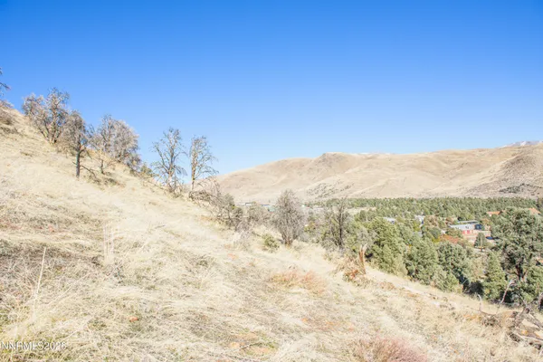 a view of a town with mountains in the background