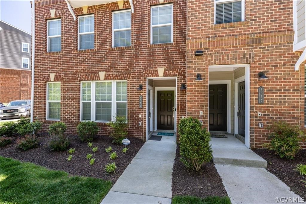 4332 Saunders Station Loop, Unit A Henrico, VA 23233 - Photo 3 of 4 a house view with a garden space