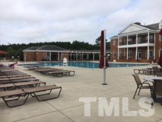 413 Starkey Street Raleigh, NC 27603 - Photo 15 of 20 a swimming pool with outdoor seating and yard