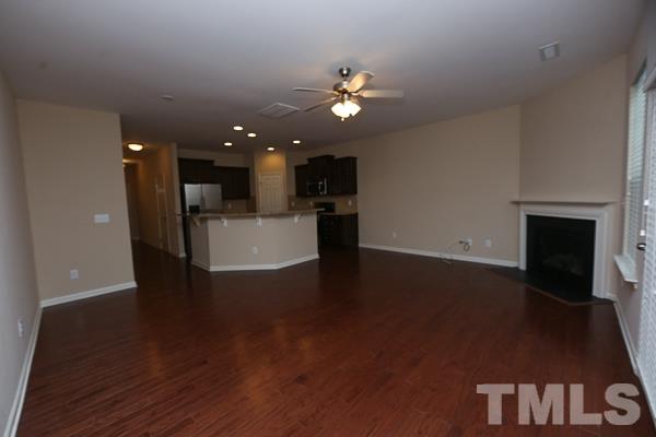 413 Starkey Street Raleigh, NC 27603 - Photo 3 of 20 a view of a livingroom with a kitchen