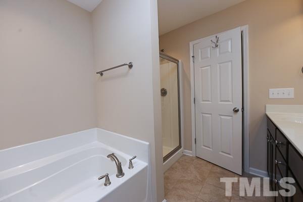 413 Starkey Street Raleigh, NC 27603 - Photo 8 of 20 a bathroom with a bathtub