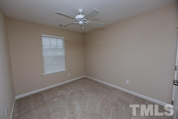 413 Starkey Street Raleigh, NC 27603 - Photo 9 of 20 an empty room with a window