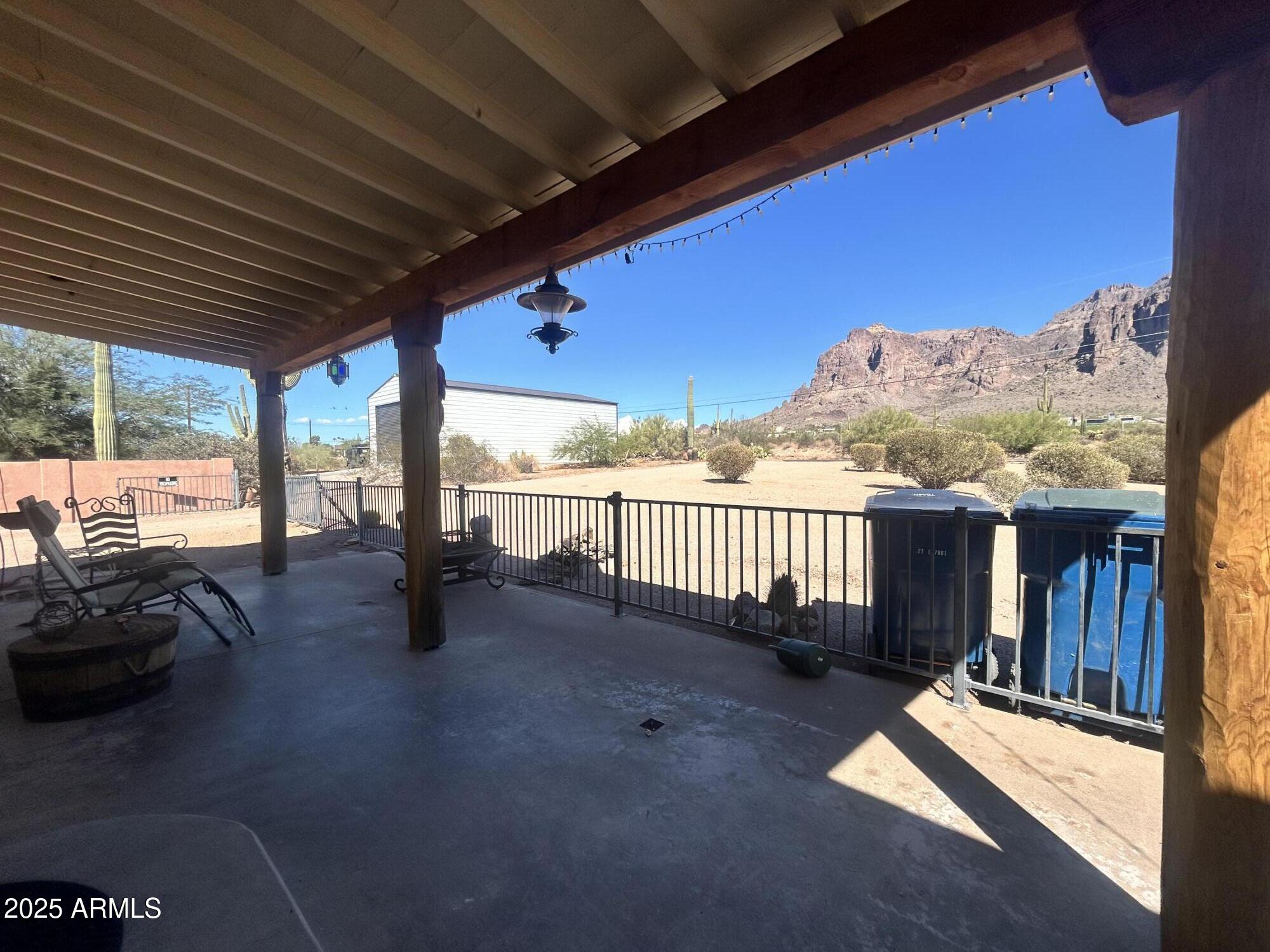 2950 North Val Vista Road Apache Junction, AZ 85119 - Photo 17 of 30 a view of a porch with furniture and a yard