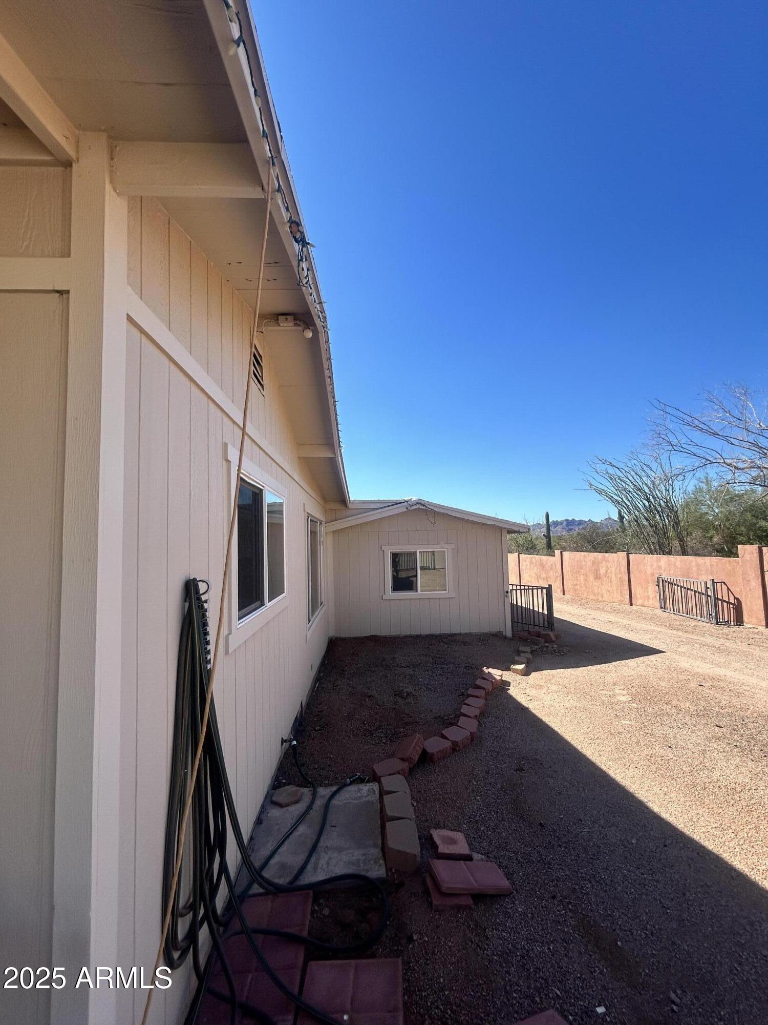 2950 North Val Vista Road Apache Junction, AZ 85119 - Photo 18 of 30 a backyard of a house with table and chairs