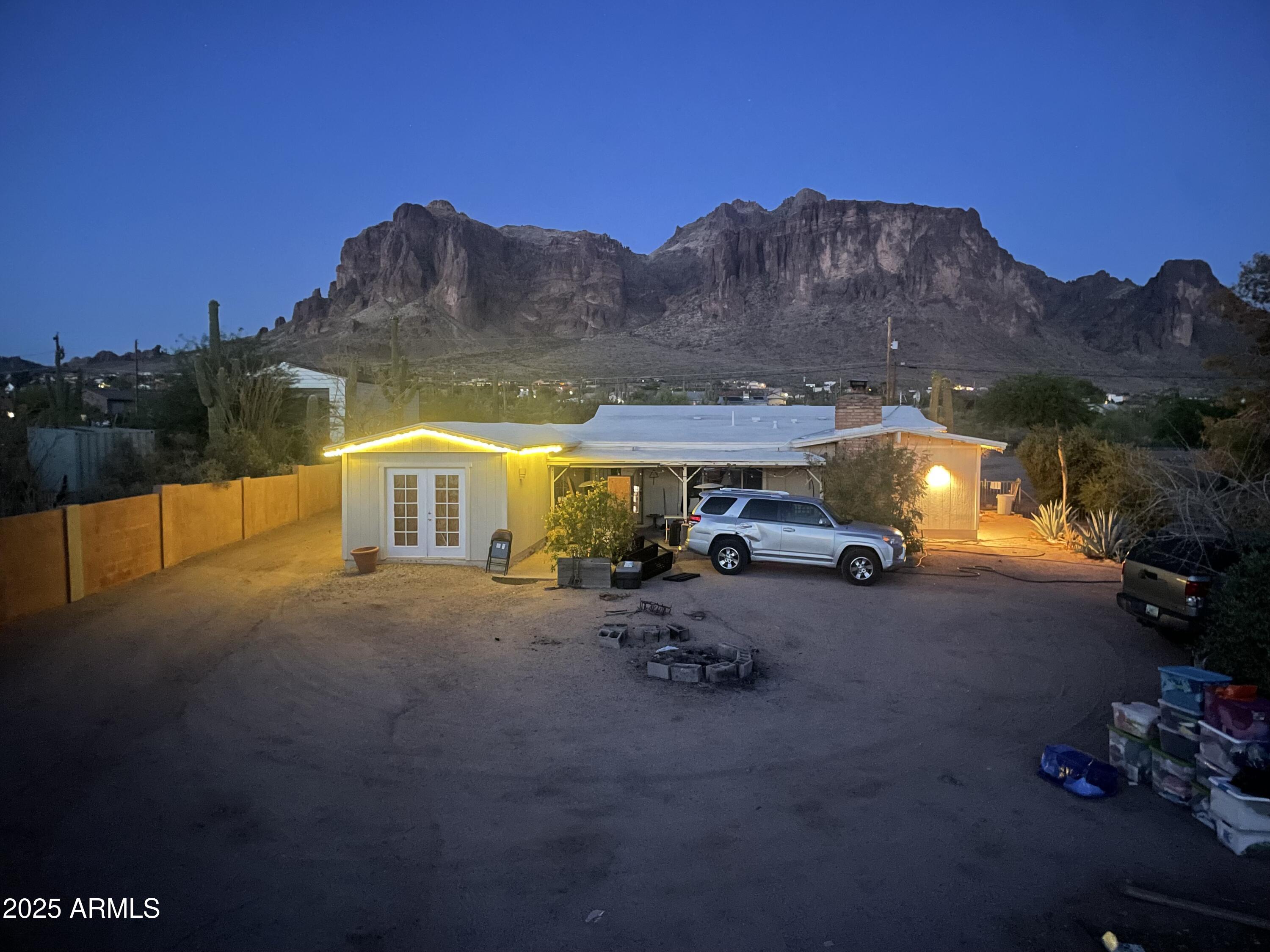 2950 North Val Vista Road Apache Junction, AZ 85119 - Photo 20 of 30 a view of a house with a yard and a car parked