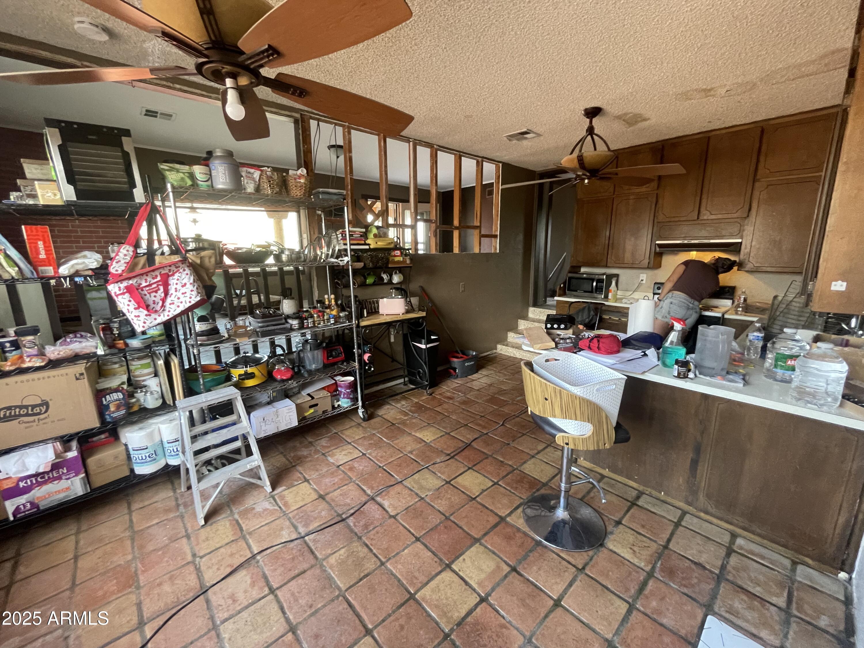 2950 North Val Vista Road Apache Junction, AZ 85119 - Photo 22 of 30 a room with storage and a table