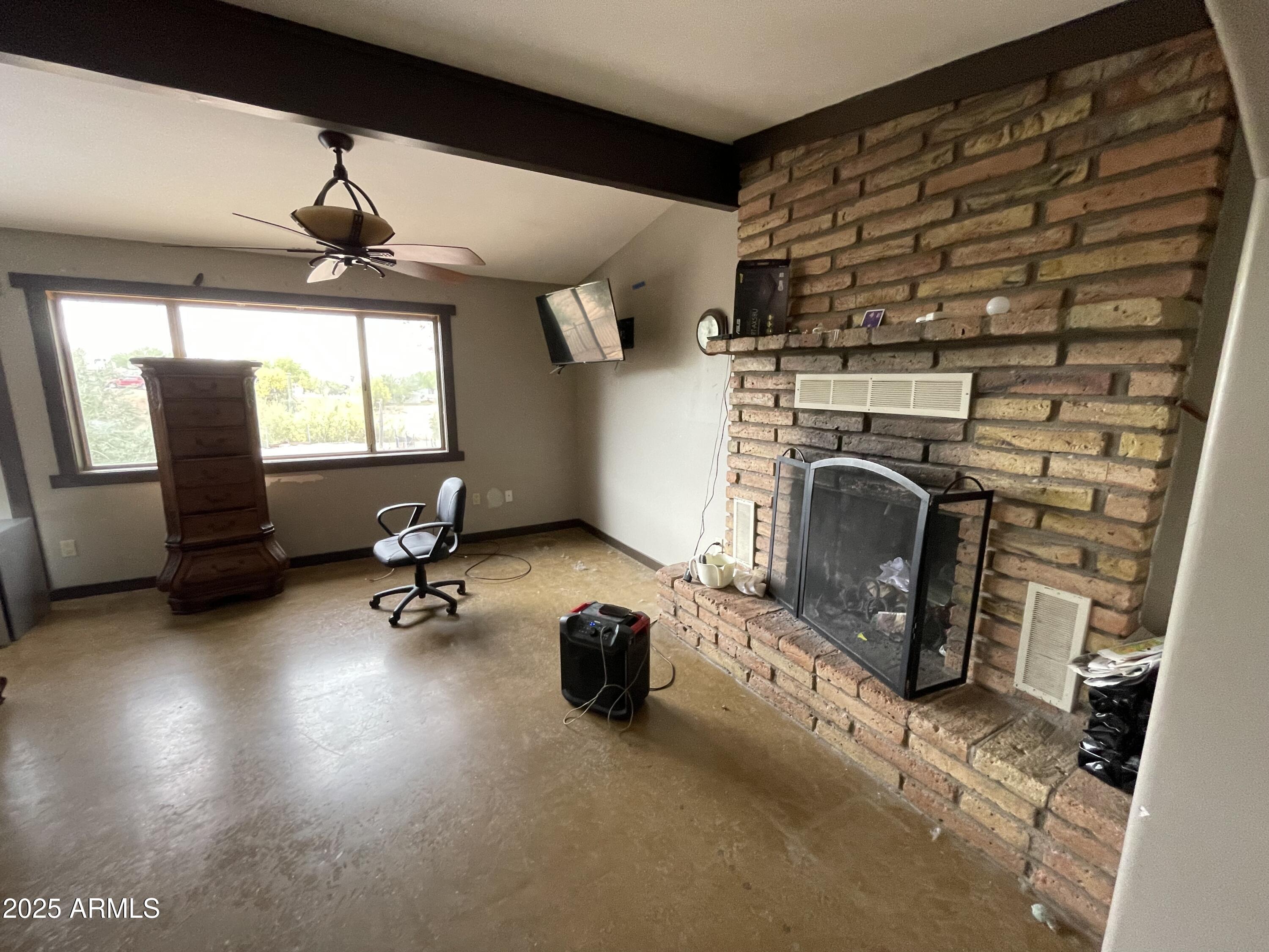 2950 North Val Vista Road Apache Junction, AZ 85119 - Photo 24 of 30 a view of a livingroom with furniture and a fireplace